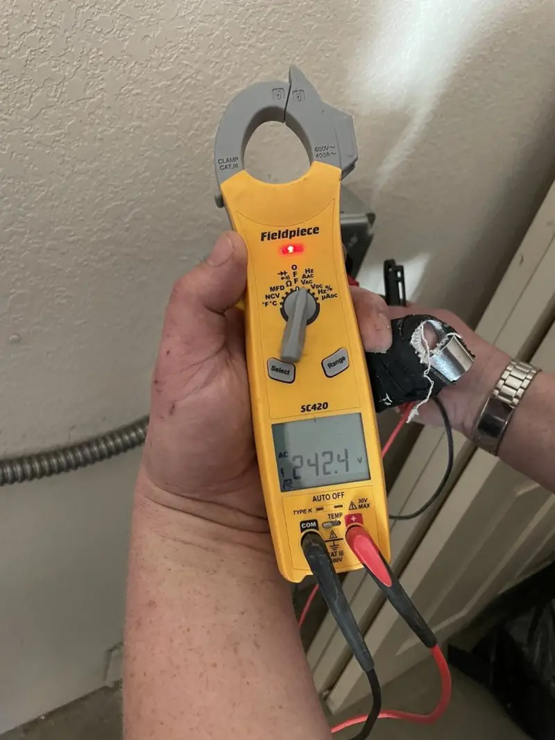 Voltage testing with clamp meter during Generator Installation in Kissimmee